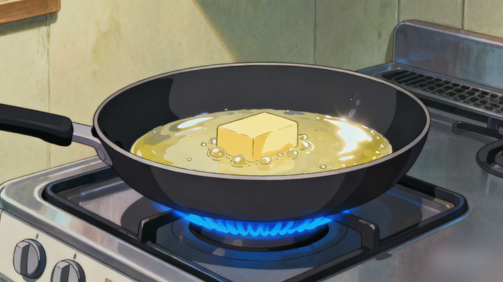 Butter melting in a skillet over medium heat, base preparation for homemade sweet glazed carrots